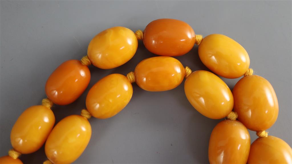 A single strand graduated oval amber bead necklace, 86cm, gross weight 112 grams,